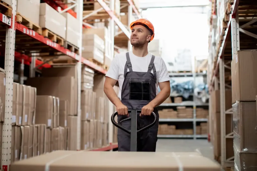 Warehouse workers remove items from shelves for picking.