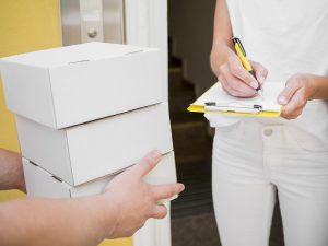 close up woman receiving package